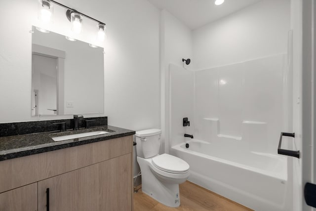 57 Hidden Cedar Loop, Columbia Falls, MT 59912 - full bathroom with vanity, wood finished floors, and  shower combination
