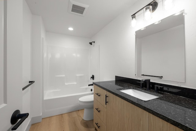 57 Hidden Cedar Loop, Columbia Falls, MT 59912 - full bathroom with vanity, wood finished floors, washtub / shower combination, and recessed lighting