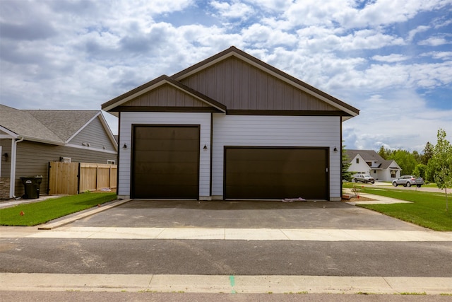 57 Hidden Cedar Loop, Columbia Falls, MT 59912 - view of front of home featuring a garage and an outbuilding