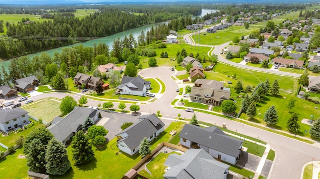 57 Hidden Cedar Loop, Columbia Falls, MT 59912 - aerial perspective of suburban area with a nearby body of water and a heavily wooded area