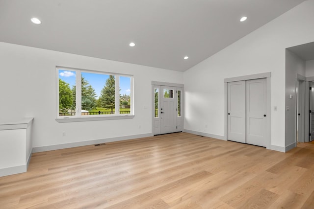 57 Hidden Cedar Loop, Columbia Falls, MT 59912 - entryway featuring recessed lighting, high vaulted ceiling, and light wood-type flooring