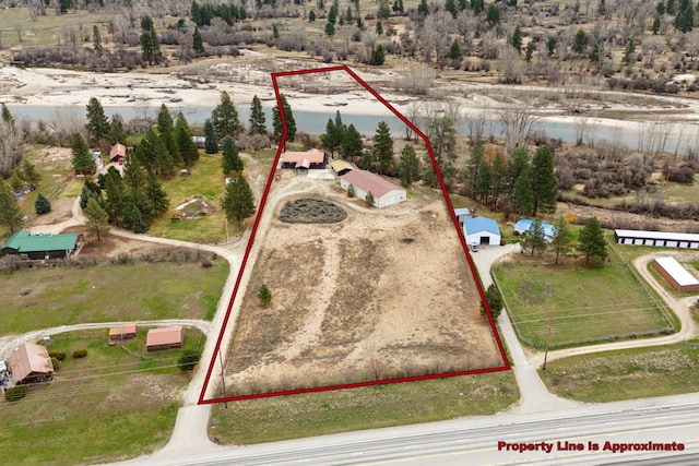 birds eye view of property with a rural view