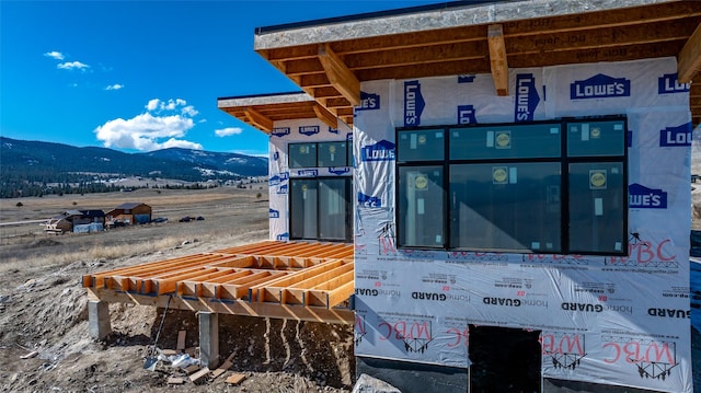 exterior space featuring a mountain view