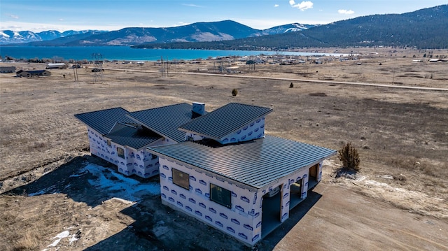 bird's eye view with a water and mountain view