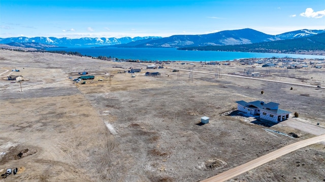 bird's eye view with a water and mountain view