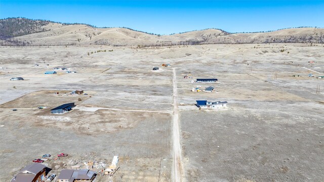 aerial view with a mountain view and a desert view