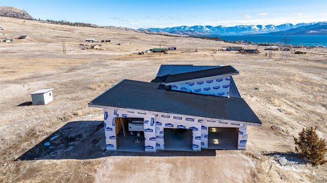 drone / aerial view featuring a mountain view