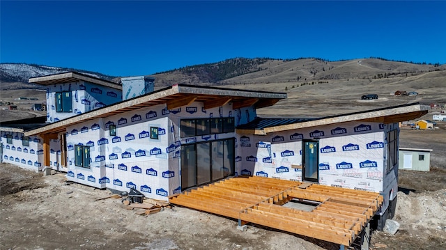 view of home's exterior featuring a mountain view