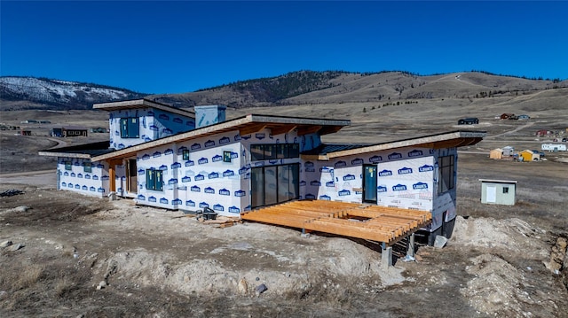 view of home's exterior with a mountain view