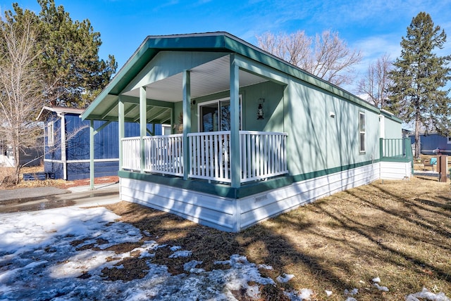 view of property exterior with a porch