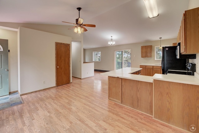 6520 Canyon Ferry Rd, Helena, MT 59602 - kitchen with range with electric stovetop, a peninsula, ceiling fan, light countertops, and light wood-style floors