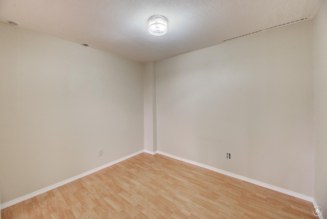 6520 Canyon Ferry Rd, Helena, MT 59602 - unfurnished room featuring light wood-style floors and a textured ceiling