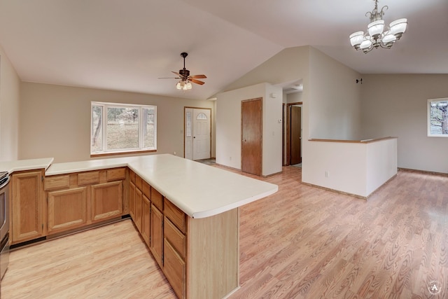 6520 Canyon Ferry Rd, Helena, MT 59602 - kitchen featuring light wood-style flooring, ceiling fan, light countertops, vaulted ceiling, and hanging light fixtures