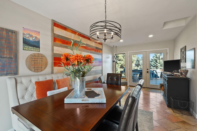 dining room with a chandelier, recessed lighting, and french doors