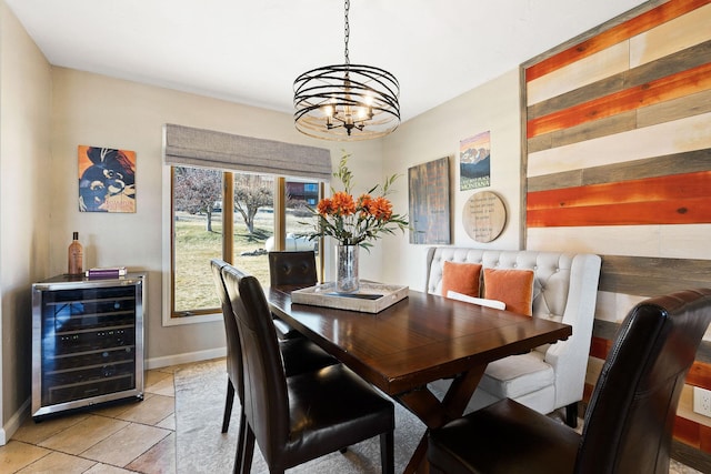128 Sunset Rdg, Lakeside, MT 59922 - dining space featuring wine cooler, a chandelier, plenty of natural light, and light tile patterned floors