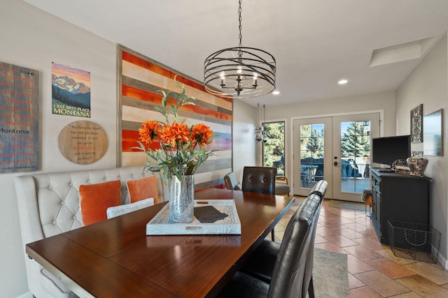 128 Sunset Rdg, Lakeside, MT 59922 - dining space with french doors, a chandelier, recessed lighting, and baseboards