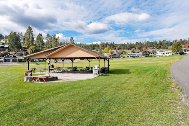 view of home's community with a gazebo and a lawn