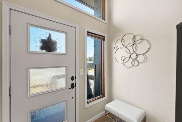 entryway featuring baseboards