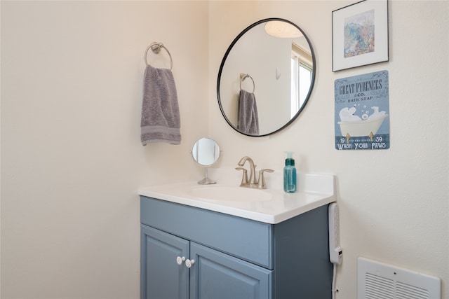 bathroom featuring vanity and visible vents