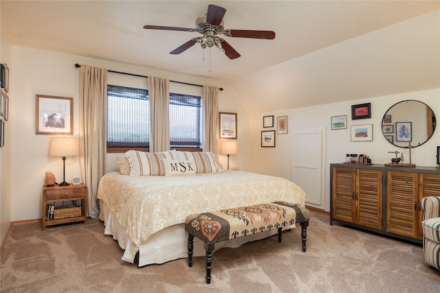 carpeted bedroom with baseboards, lofted ceiling, and a ceiling fan