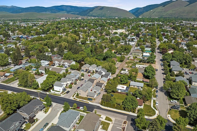 birds eye view of property with a mountain view and a residential view