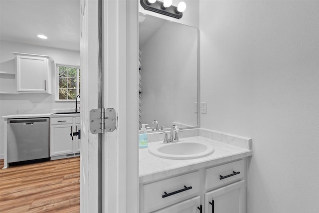 bathroom featuring vanity and wood finished floors