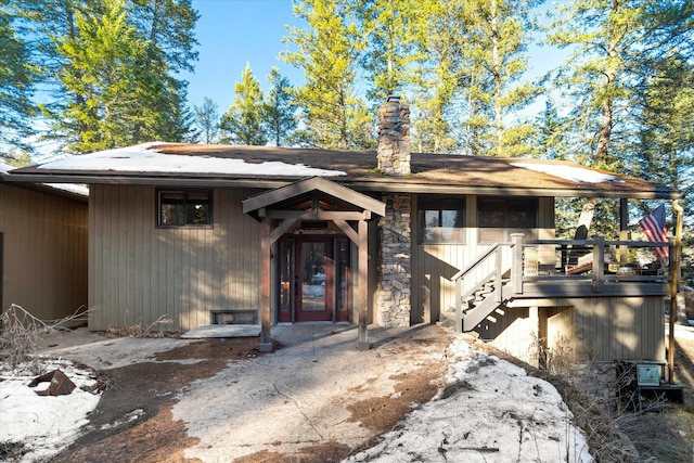 property entrance featuring a chimney