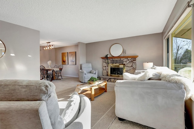 living room featuring light carpet, a textured ceiling, a stone fireplace, and a chandelier