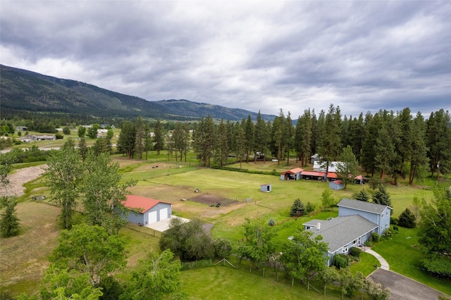 birds eye view of property with a rural view and a mountain view