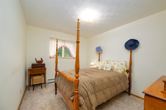 carpeted bedroom featuring baseboards and baseboard heating