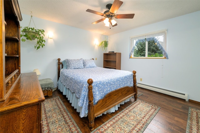 bedroom featuring a textured ceiling, a baseboard heating unit, a ceiling fan, and wood-type flooring