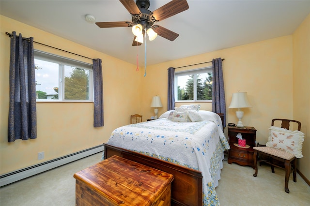 bedroom featuring light colored carpet, ceiling fan, and a baseboard radiator