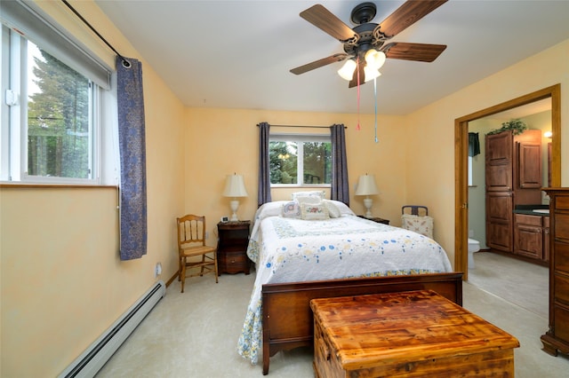 5400 Two Moons Rd, Florence, MT 59833 - bedroom with light colored carpet, a baseboard radiator, and ceiling fan