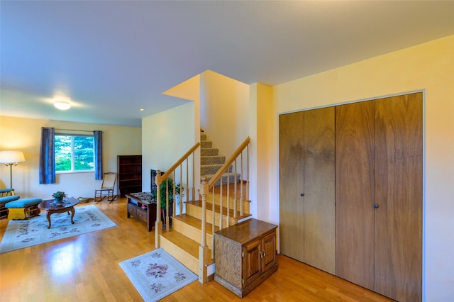 interior space featuring stairs and light wood-style floors