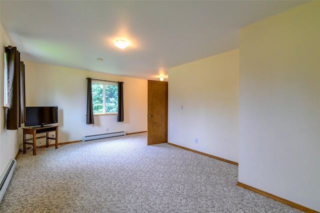 interior space featuring a baseboard heating unit, carpet, and baseboards