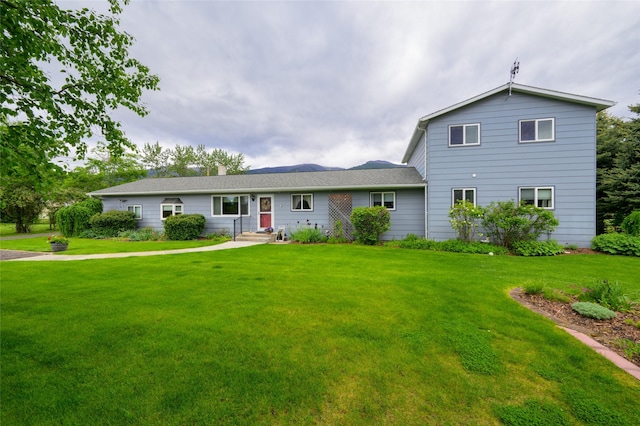 view of front of house with a front yard and entry steps