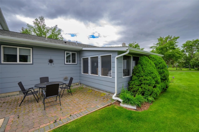 5400 Two Moons Rd, Florence, MT 59833 - rear view of property with a patio and a lawn