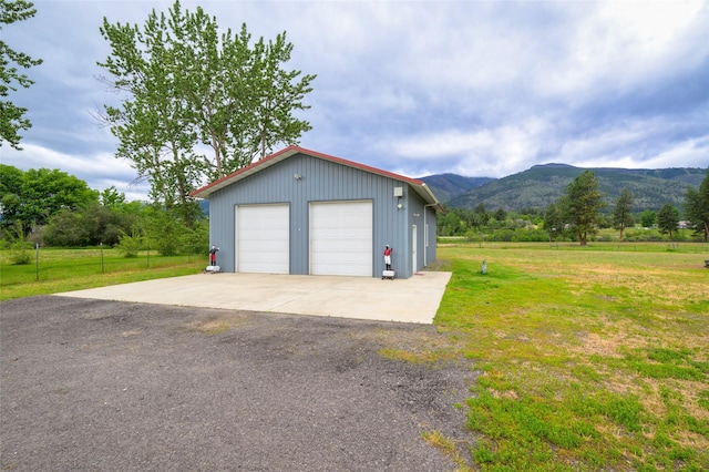 detached garage featuring a mountain view