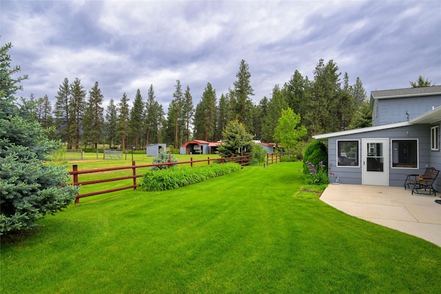 view of yard with a patio and fence