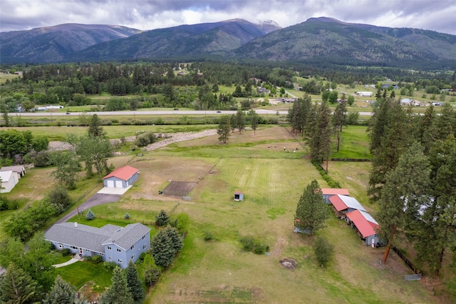 drone / aerial view with a mountain view and a rural view