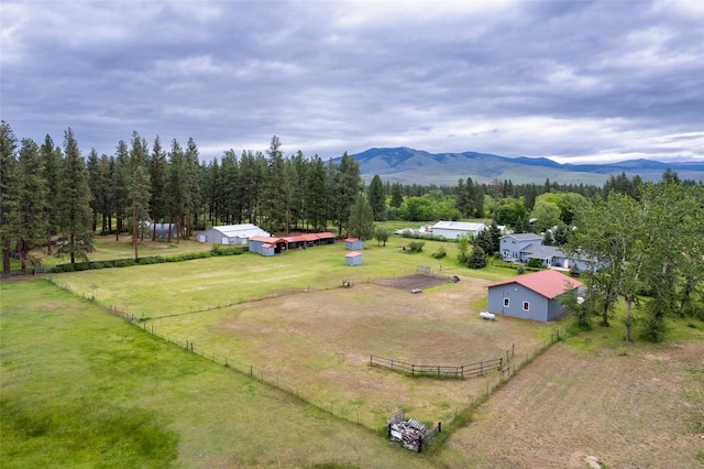 drone / aerial view featuring a mountain view and a rural view