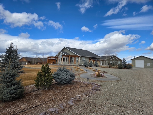 rear view of property featuring an outdoor structure