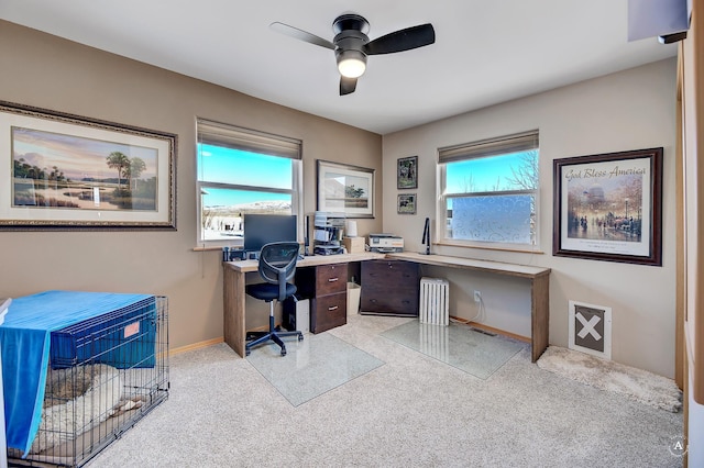 office area with a wealth of natural light, baseboards, and a ceiling fan