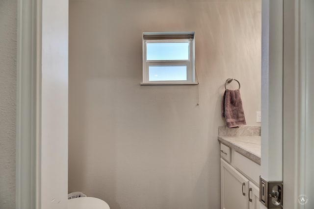 half bath with toilet and vanity