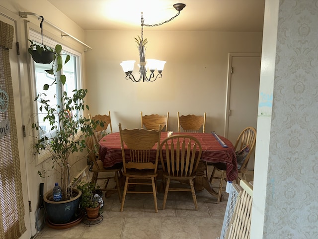 dining area featuring a notable chandelier