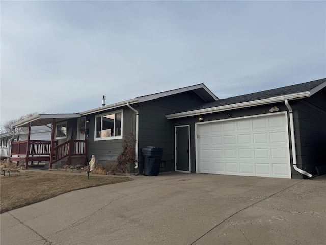 ranch-style house featuring an attached garage and driveway