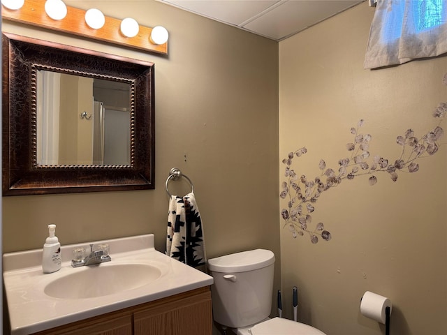 bathroom with toilet and vanity