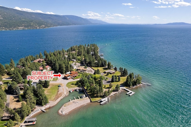 aerial view featuring a water and mountain view