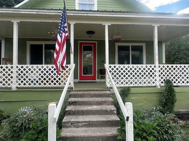 doorway to property with covered porch