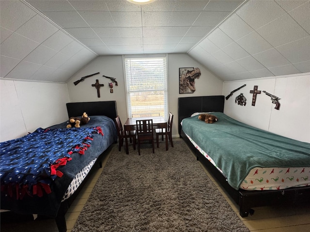 bedroom featuring carpet and vaulted ceiling